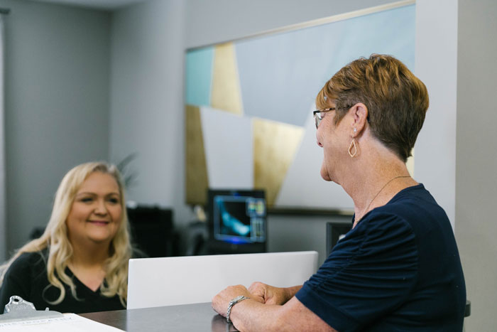 Patient at the front desk of the Neuropathy Treatment Clinic of Oklahoma